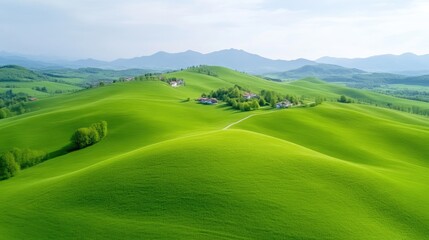 Lush rolling hills with a small village nestled amongst them