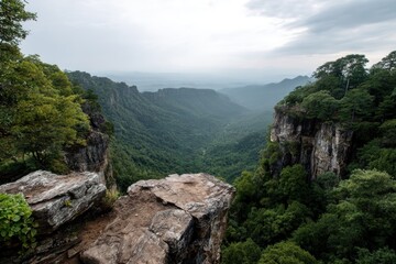 Majestic mountain landscape with lush greenery and distant peaks during early morning in a serene wilderness