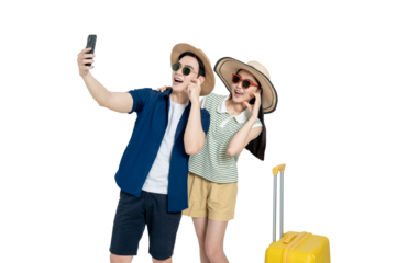 portrait of asian couple wearing travel clothes, suitcases and using phone posing on background