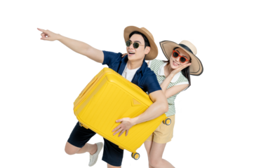 portrait of asian couple wearing travel clothes, carrying suitcases and posing on white background