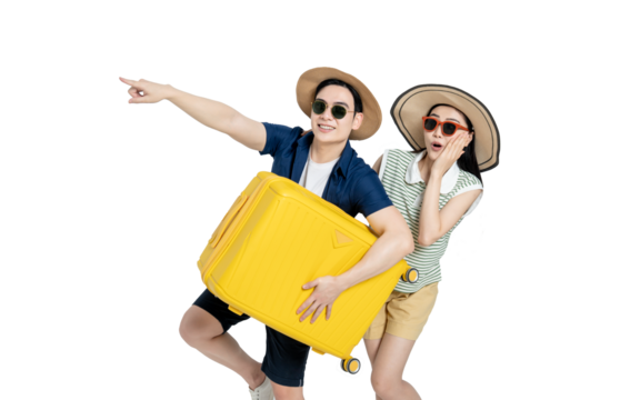 portrait of asian couple wearing travel clothes, carrying suitcases and posing on white background