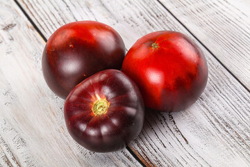 Black ripe juicy organic tomato