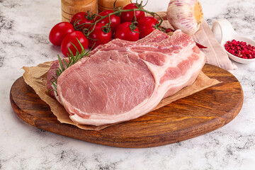 Raw potk loin steak with bone