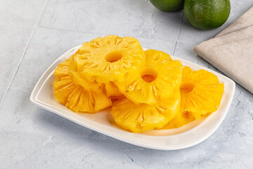 Sweet canned pineapple slices in syrope