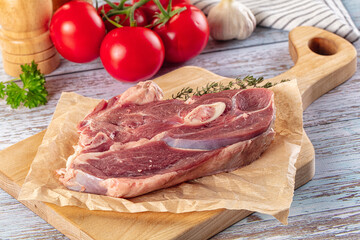 Raw lamb steak with bone