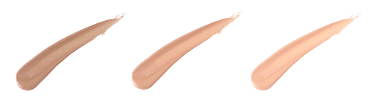 Makeup liquid foundation smear composition isolated on white background, different shades of foundation
