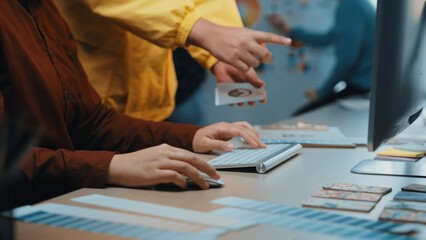 A collaborative scene in a modern office showcasing team members discussing creative ideas while working on a computer. The engaging atmosphere fosters innovation and teamwork. SACTR