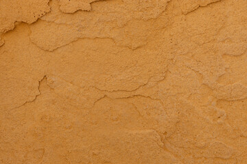 Close up of textured ochre wall surface