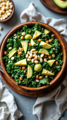 A fresh kale salad with avocado, cashews, and other nuts on top, garnished with lime slices. Perfect for a keto-friendly lunch or snack.