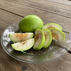 fresh green guavas on a olate