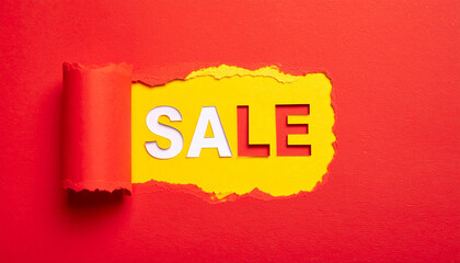 Torn yellow paper revealing the word SALE against bright red background.