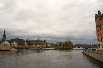 Heading to Gamla Stan over a bridge side view of Stockholm on an overcast day, Sweden