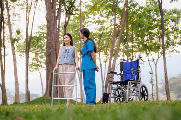 Fototapeta premium With gentle attention and encouragement, a dedicated female physical therapist assists her patient in practicing rehabilitation exercises in the hospital's outdoor garden.