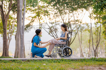 A devoted female physician lovingly cares for her elderly wheelchair-bound patient, offering support and attention with the warmth of a family member.
