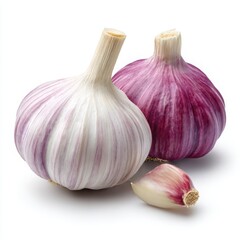 Obraz premium Two garlic bulbs and clove isolated on white background