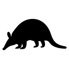 Silhouette of a nine banded armadillo looking for food in the wild