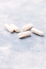 Coenzyme Q10 capsules. Antioxidants. Concept for a healthy dietary supplementation. Bright background. Soft focus. Close up. Copy space.	