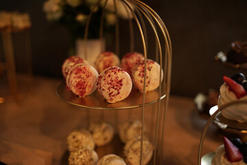 Chocolate pastries on a beautiful stand in the buffet.