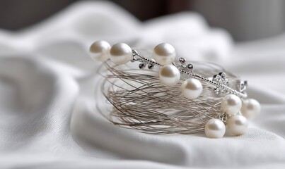 Pearlstudded tiara resting on silky fabric
