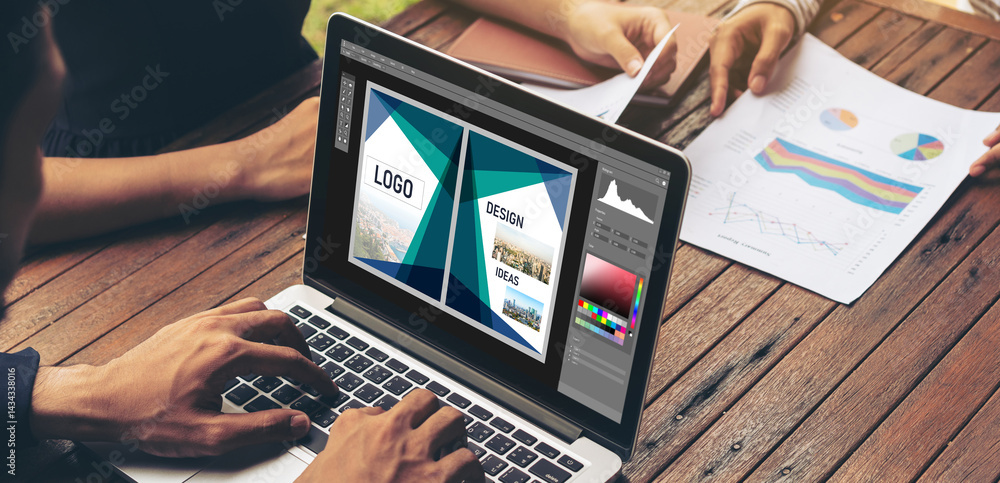 Poster graphic designer software for modern design of web page and commercial ads showing on the computer s
