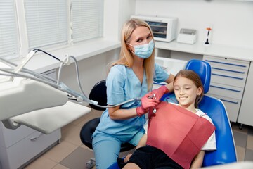 Obraz premium Children's dentistry, Smiling dentist, pediatric dentist, healthy smile, Child visit dentist, stomatological cabinet, dental clinic