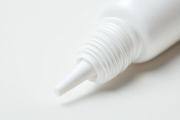 adhesive isolated white plastic bottle on a white backdrop