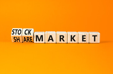 Stock or share market symbol. Concept words Stock market or Share market on beautiful wooden blocks. Beautiful orange table orange background. Business stock or share market concept. Copy space.