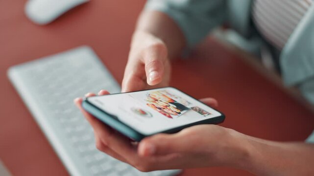 Person, hands or browsing food menu with phone for order, online delivery or takeaway dinner. Closeup, user or customer scrolling on restaurant website or app with mobile smartphone screen for meal
