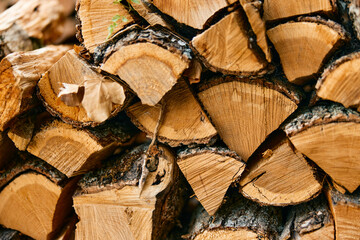 stack of firewood with 'wood' written on it, rustic outdoor background