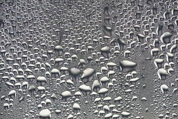 background, unusual, abstract. drops of morning dew, condensation on the glass. wet glass. water drops close-up. beautiful background for text. Spray cool condensate water on the glas