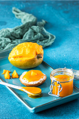 Homemade mango chuntney on a blue background