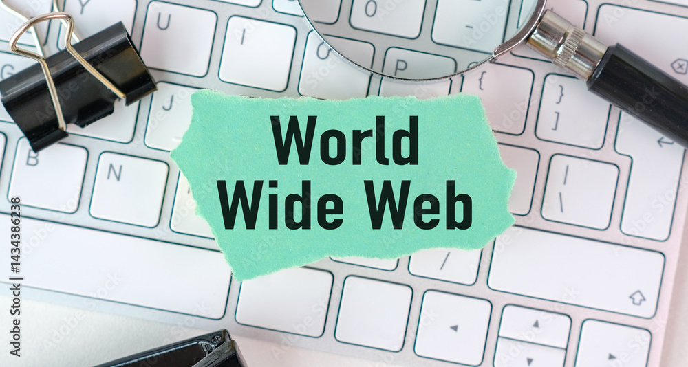 Poster a keyboard with a piece of paper that says world wide web on it