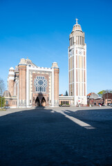 Fototapeta premium Saint Chrysolius and Saint Peter Church with the belfry tower at the old market square of Comines - Hauts De France