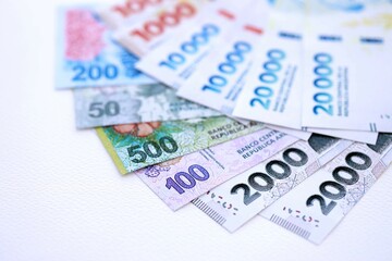 Argentine pesos money bills in big amount lies on white table close up
