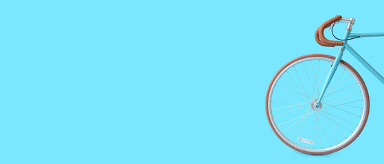 Modern bicycle on blue background