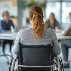 Woman in wheelchair attending business meeting indoors back view inclusion