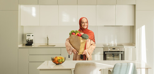 Young muslim woman in a kitchen