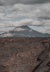Lava fields with a volcano in the background