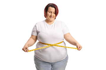 Plus size woman measuring waist with a tape