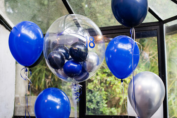 Blue balloons and clear decor party