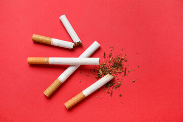 Different cigarettes on red background. No Tobacco Day concept