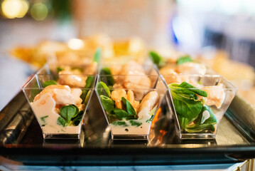 Tasty appetizer in glass cups