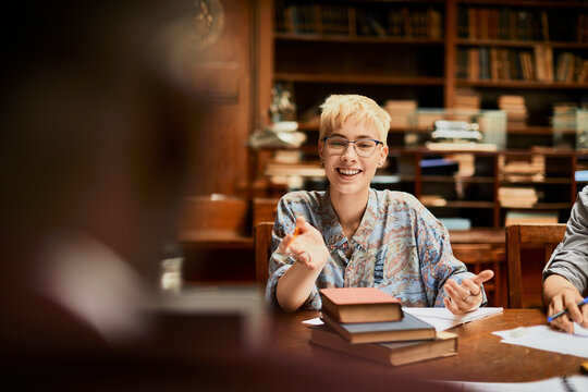 Young and diverse group of students studying in a university library