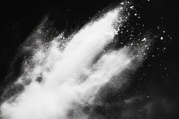 A white powder explosion against a black background