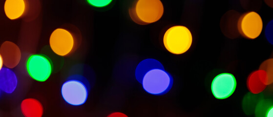 Multicolored Abstract Bokeh Lights Featuring Yellow Green Blue Red Orange Circles on Dark Festive Background
