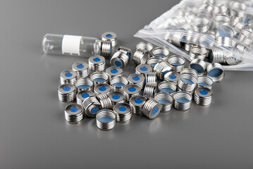 HPLC, gas chromatography measuring, vials for autosampler. circular metallic cap with rubber septum for vials.