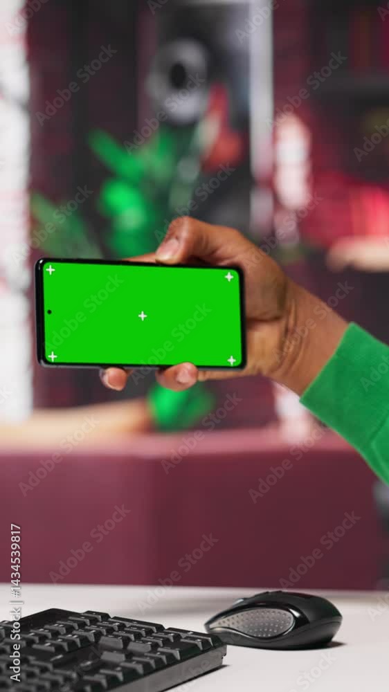 Poster vertical video african american man engaging with ai chatbot next to chroma key, using the virtual a