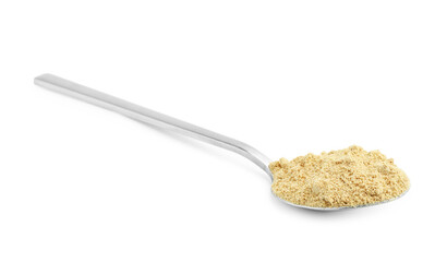 Superfood. Mustard powder in spoon isolated on white