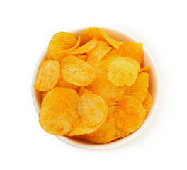 Tasty ridged chips in bowl isolated on white, top view