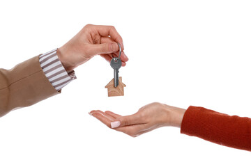 Real estate agent giving house key to new owner on white background, closeup